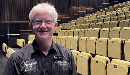 Photo of Callan standing in the Bay Pavilions Theatre