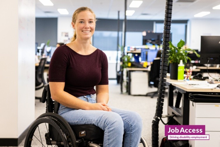 Person in a wheelchair in an office space.
