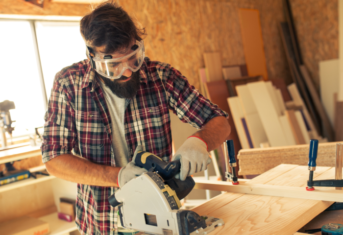A carpenter doing his job in a carpentry workshop.