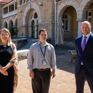 (from left to right) Kristen Potter, Group Manager Organisational and Cultural Development; Joshua Ford, Records Assistant; and Nick Foster, General Counsel are standing outside The Perth Mint office and looking at the camera.